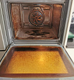 burnt on carbon stained oven before restoration